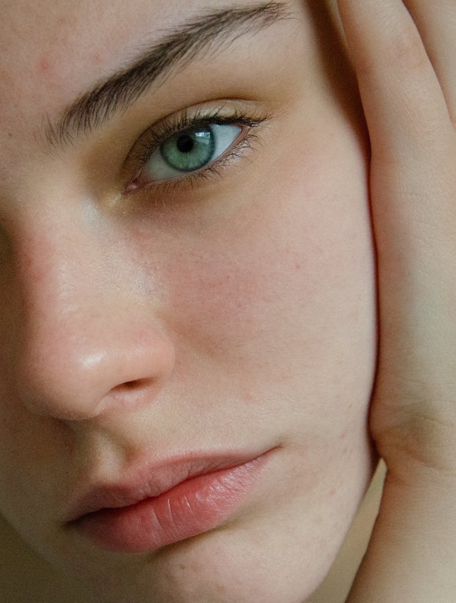 A close up of a woman with green eyes